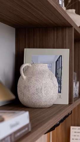 Styled walnut joinery shelf detail with ceramics and books, custom-made furniture by Level Up Interior Design